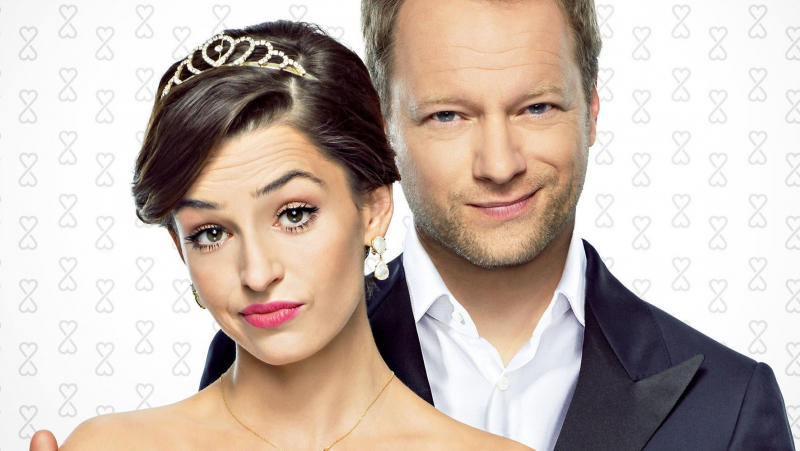 Maciej Stuhr i Agnieszka Więdłocha na plakacie filmu Planeta Singli 2
